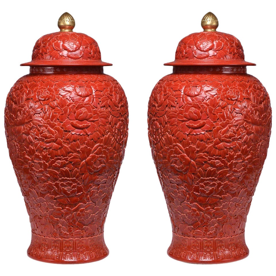 Pair of Fine Carved Red Glazed Porcelain Jars with Covers
