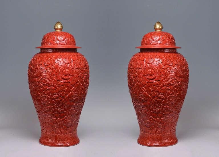 Fine carved porcelain jars with flower blossom decorations.