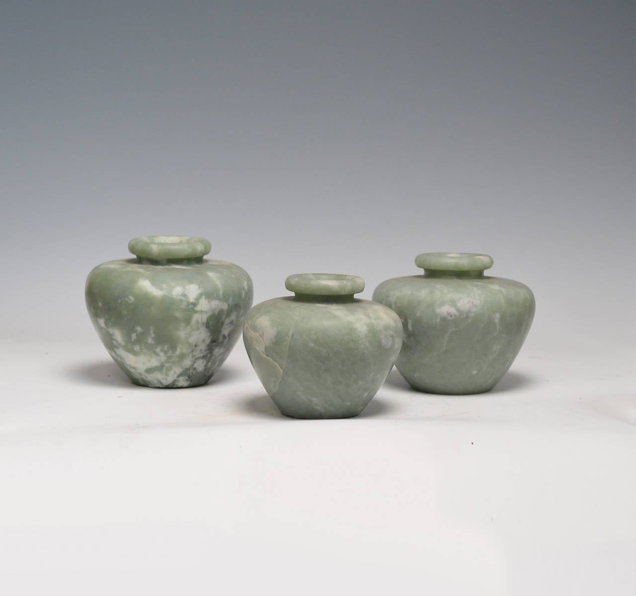 Group of three fine carved celadon jade jars.
Measure: 6