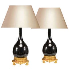 A Pair Of Ormolu Mounted Black Porcelain Lamps