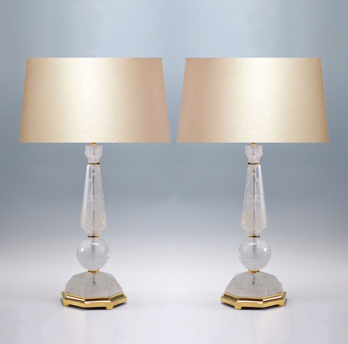Pair of fine carved prism and globe form rock crystal quartz lamps with polish brass base, created by Phoenix Gallery, NYC.
Available in nickel plating and antique brass finished.
Measure: To the rock crystal: 21.5