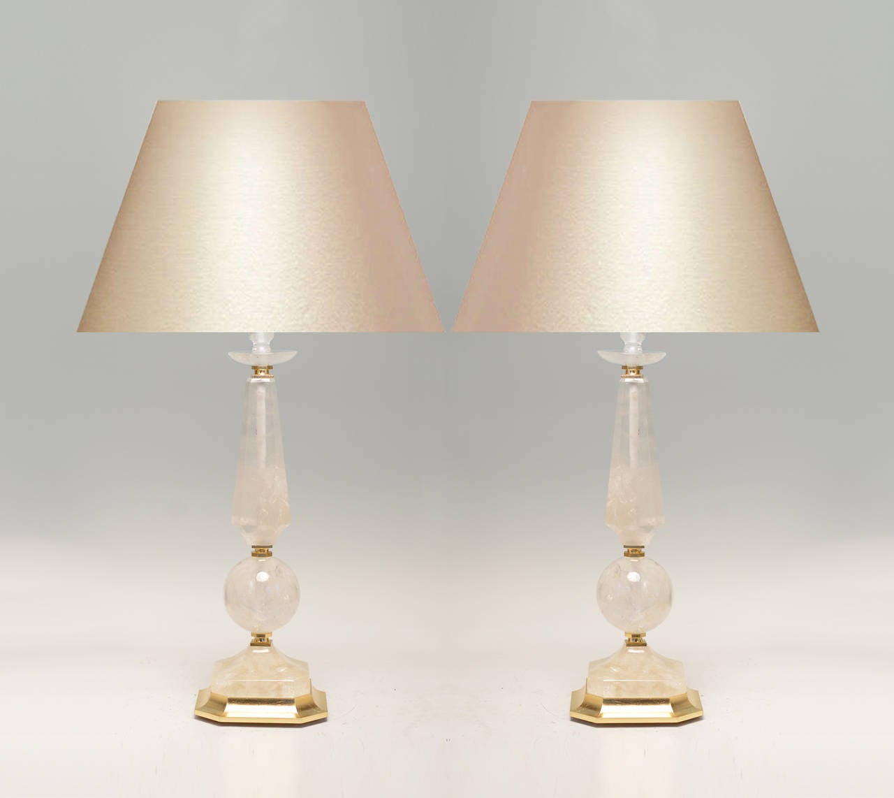A fine carved prism and globe form rock crystal quartz lamp with polish brass base, created by Phoenix Gallery, NYC.
Available in nickel plating and antique brass finished.
To the rock crystal: 21