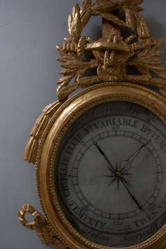 Louis XVI carved, gilt barometer.