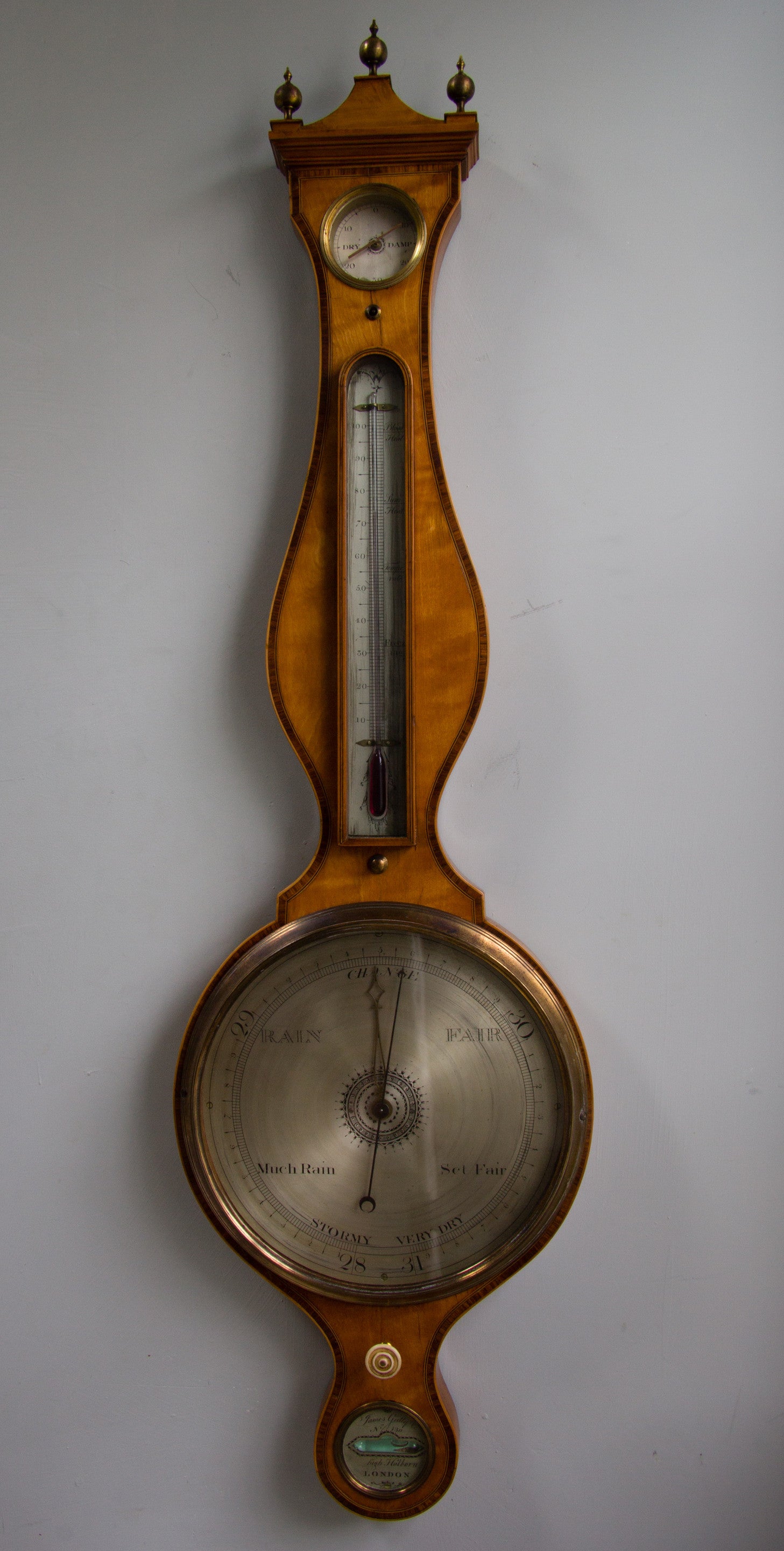 Satinwood wheel barometer signed James Gatty. London.
