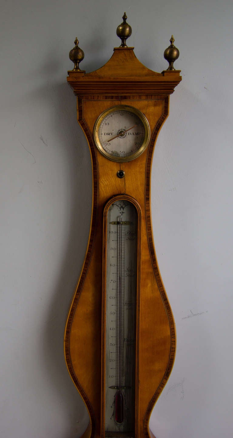 Satinwood wheel barometer signed James Gatty. London. 2