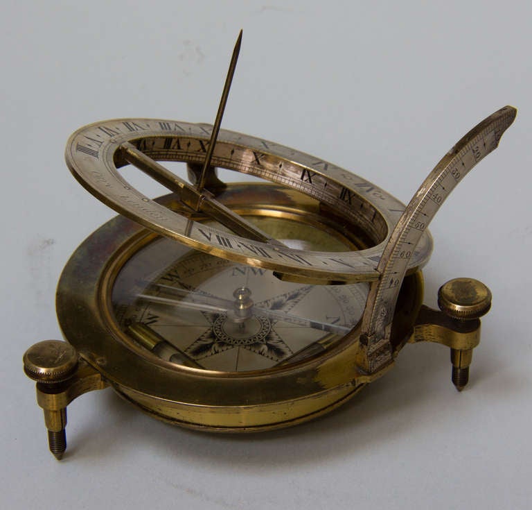 Exquisite brass sundial that retains the original lacquer, though worn through on the areas that have received the most use. The dial folds into the original leather bound and velvet lined case that is secured with 3 brass hooks. The chapter rings