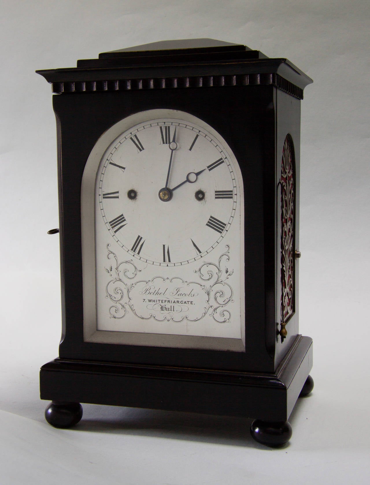 Inside the ebonised case is a well-made petit twin fusee movement that strikes the hours on a coiled gong plus a single blow on each half-hour. One can also the repeat the last hour struck by pulling the cord on the right side. An attractive feature