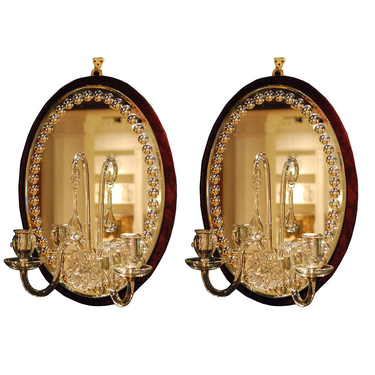Pair of Oval Burgundy Velvet-Backed Two-Light Mirrored Sconces For Sale