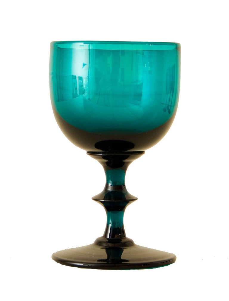A set of 10 Regency small green wine goblets with round bowls on short stems.