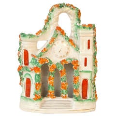 A finely modeled Staffordshire pottery cottage.