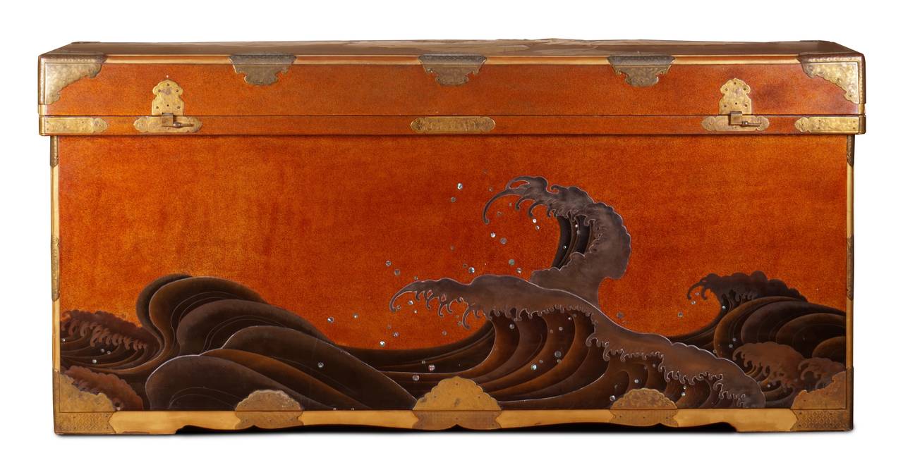 Provenance: An esteemed private collection since before 1972

This magnificent red lacquer trunk with its continuous wave is as artistically relevant today as it was 180 years ago when it was created.

The slightly domed lid decorated in low relief
