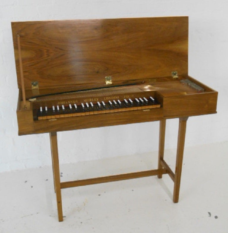 John Morley Clavichord in walnut on a trestle stand.
Four octaves C to D.
No.748, circa 1964 second hand.

Made in London, England.

If you are interested in Baroque and early music or just want a very quiet but responsive keyboard instrument