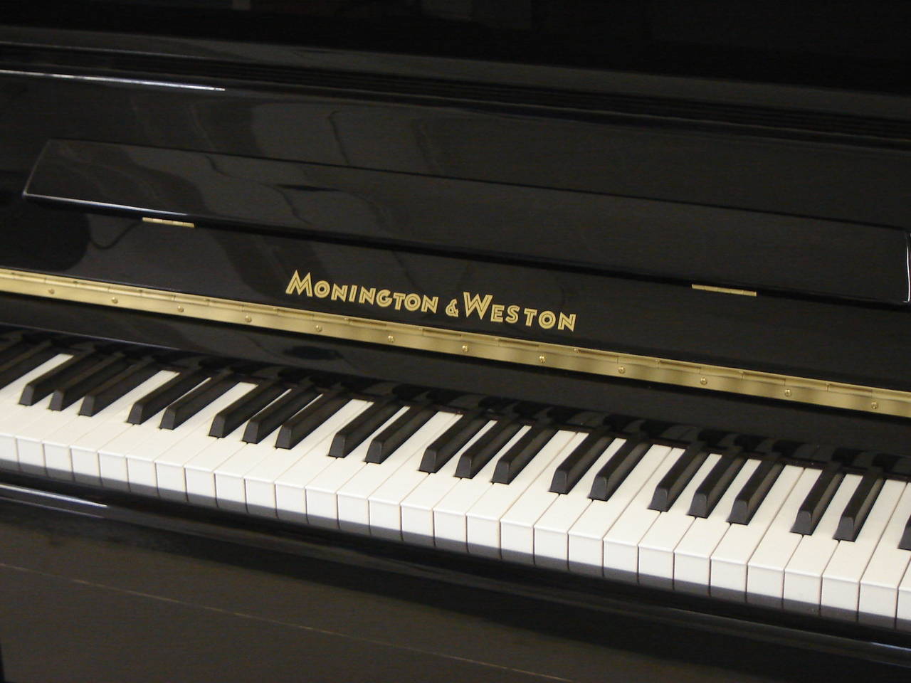 Monington & Weston 120cm traditional upright piano in black polished circa 2013 ex rental.

Full compass - 7¼ octaves – 88 notes, 
three pedals (Practise pedal).

Rent this piano on our home rental scheme for only £75.00 per month with an