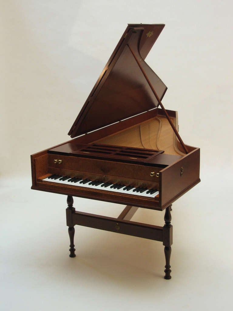 John Morley English single manual harpsichord after Culliford in mahogany with burr facia on a trestle stand with traditional brass strap hinges, hooks & handstops, wooden jacks and delrin plectra. 
2 x 8', 1 x 4' + buff 
5 octave F to F 
No.3166