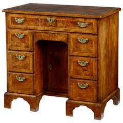 Antique George I figured walnut & feather banded kneehole desk