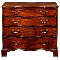 George III mahogany serpentine commode in the manner of Thomas Chippendale