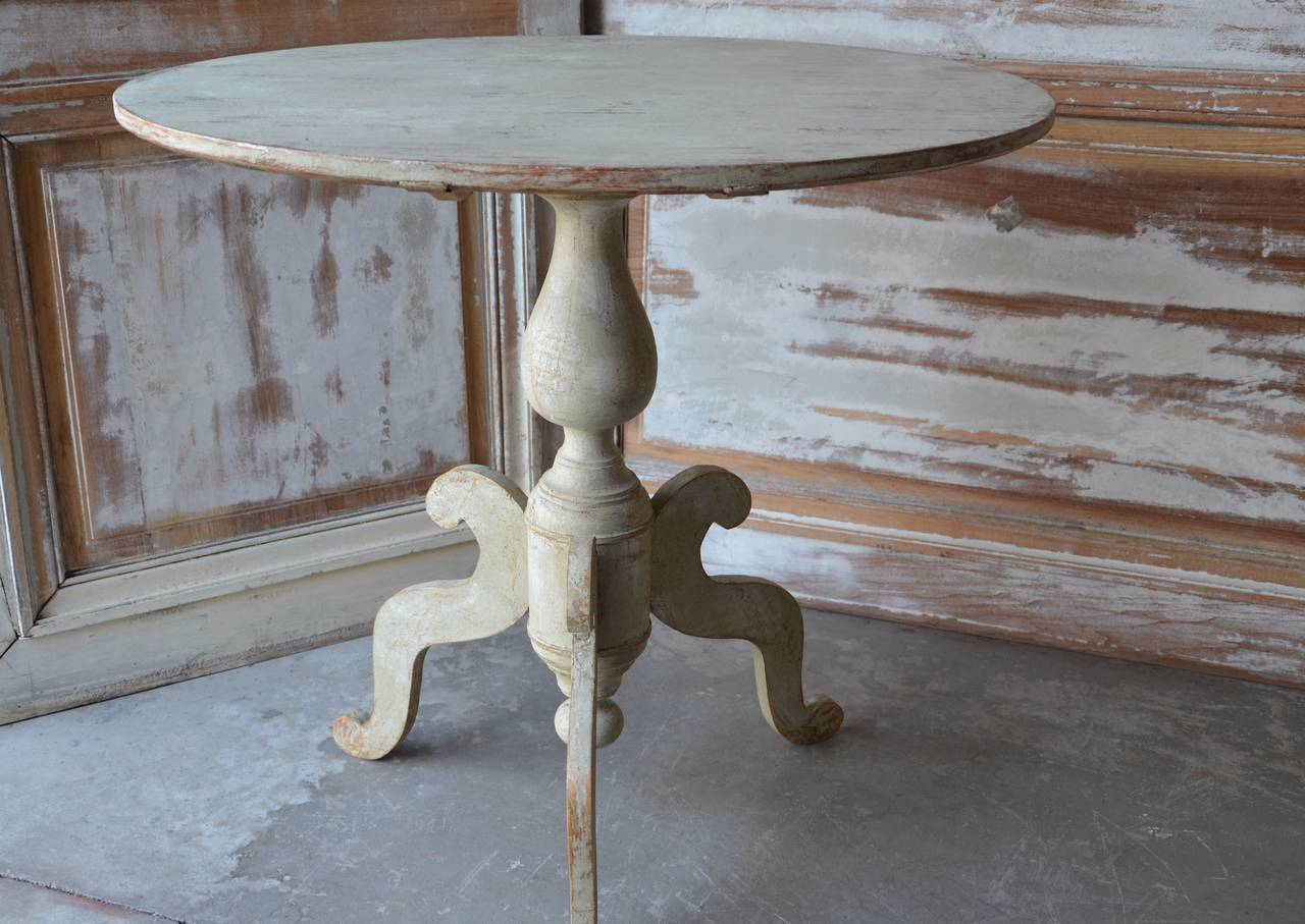 A large oval top pedestal table, Karl Johan period, Sweden, circa 1830 with turned base supported by beautifully carved legs. Scrape back to traces of its original color.