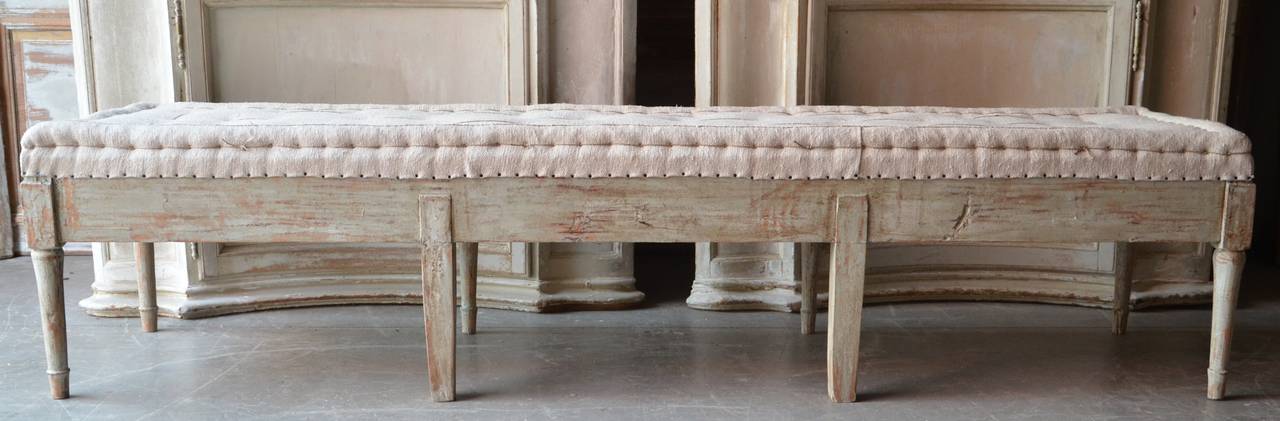 Swedish period Gustavian bench, circa 1800, finished on three sides with pearl strings and carved fluted legs. Scraped to original bluish or green finish and upholstered in traditional way in antique hand-stitched linen. Timeless antique style,