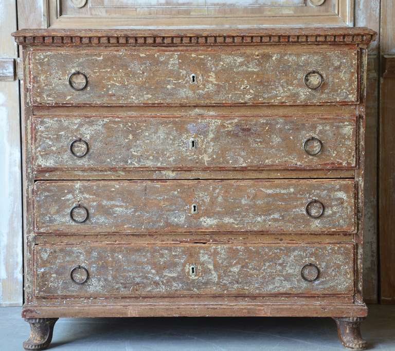 19th century Swedish provincial chest with four drawer, dental molding around the top and charming little feet with detail carvings; all in traces of multiple layers of colors and wonderful patina.
Sweden circa 1820/1840