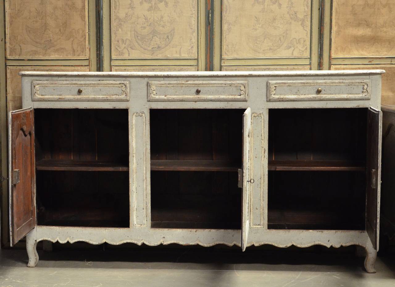 Large, handsome 19th century pained Enfilade in Louis XV style with three raised panel doors, drawers and lovely shaped apron. France, circa 1880.