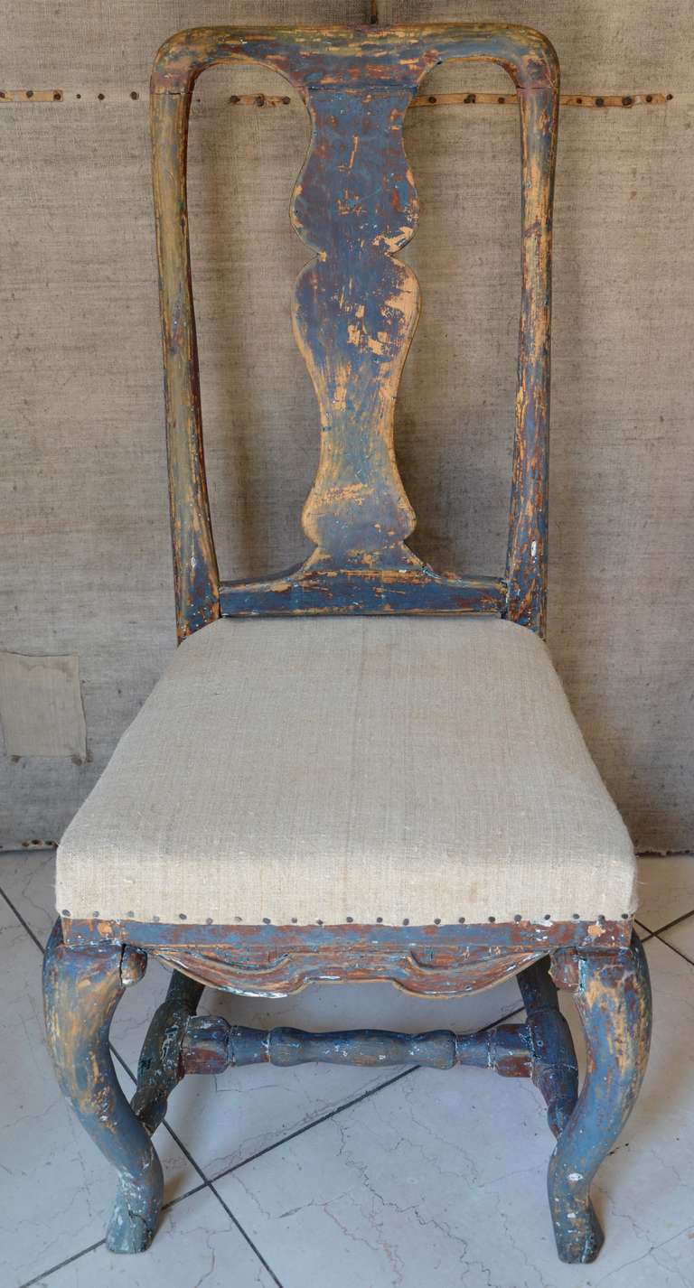 A pair of circa 1770  Swedish period Rococo chairs with shaped splat and stretcher on cabriole legs. All in the original blue worn  patina. Seat covered in hand loom antique linen. 