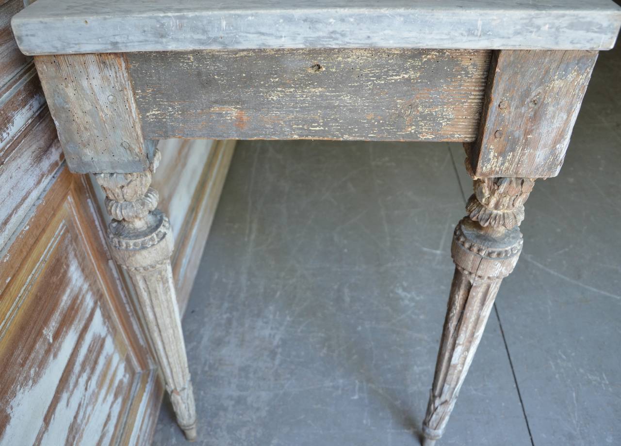 A rare beauty. 18th century period console with original worn patina, original thick marble and exceptional carvings to the legs,
France, circa 1780.