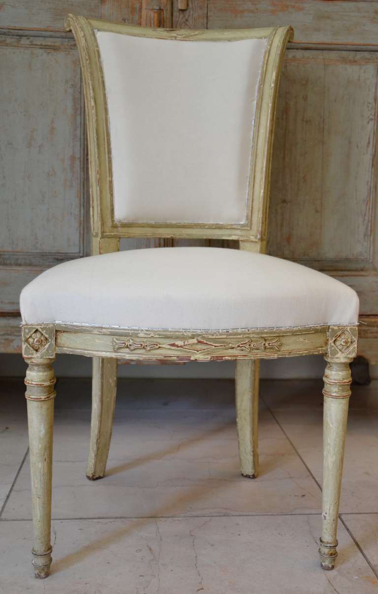 A set of six painted Directoire style chairs. 
The 