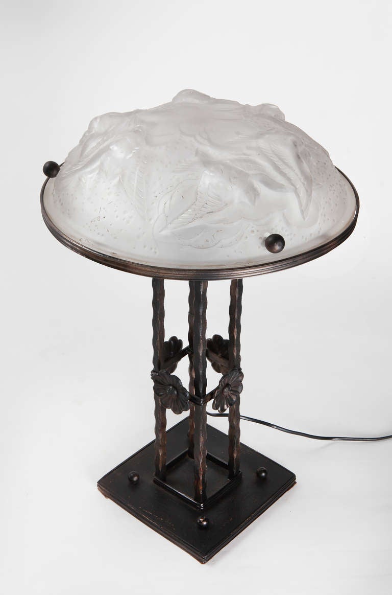 Typical hand work Jugendstil, 1932. Lamp stand is in wrought iron. Molded glass shade with birds decor.
height: 21.65 in (55 cm), diameter shade: 13.78 in (35 cm).