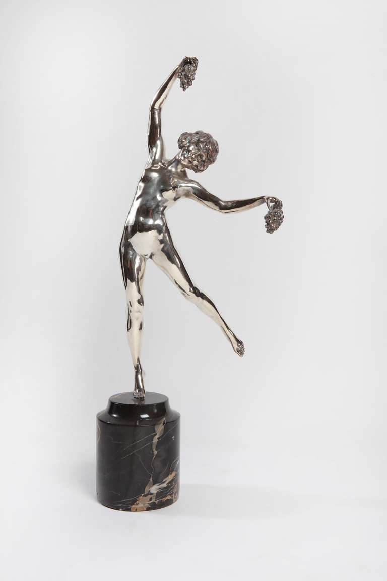 An excellent Art Deco figure by Pierre Le Faguays, France, circa 1920-1925. Bronze, silver plated on black marble round base. Signed top on base: Le Faguays. 
Height ( including base ) 23.23 in ( 59 cm ), Diameter: ca. 4.72 in ( 12 cm ).