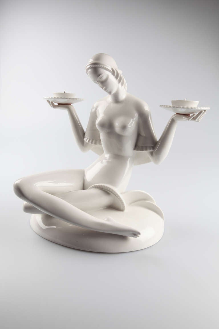 Art Deco porcelain figure. Design by Gerhard Schliepstein ( Germany 1886-1963 ), 1925. Made by KPM ( Königliche Porzellan Manufaktur ). White porcelain, glazed. Model number 12007. Marked on the back: Sceptre mark for KPM factory. 
Measures: Height