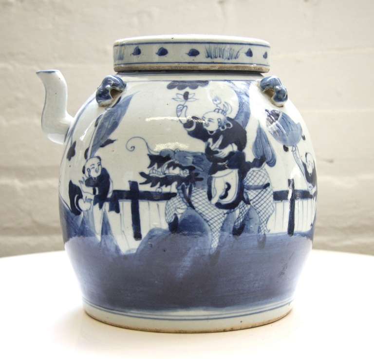 Antique Chinese Oriental blue and white hand painted ceramic porcelain teapot stands 9 inches tall..