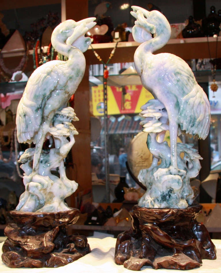 Pair hand carved Burma Jade herons mounted on carved wooden stands
