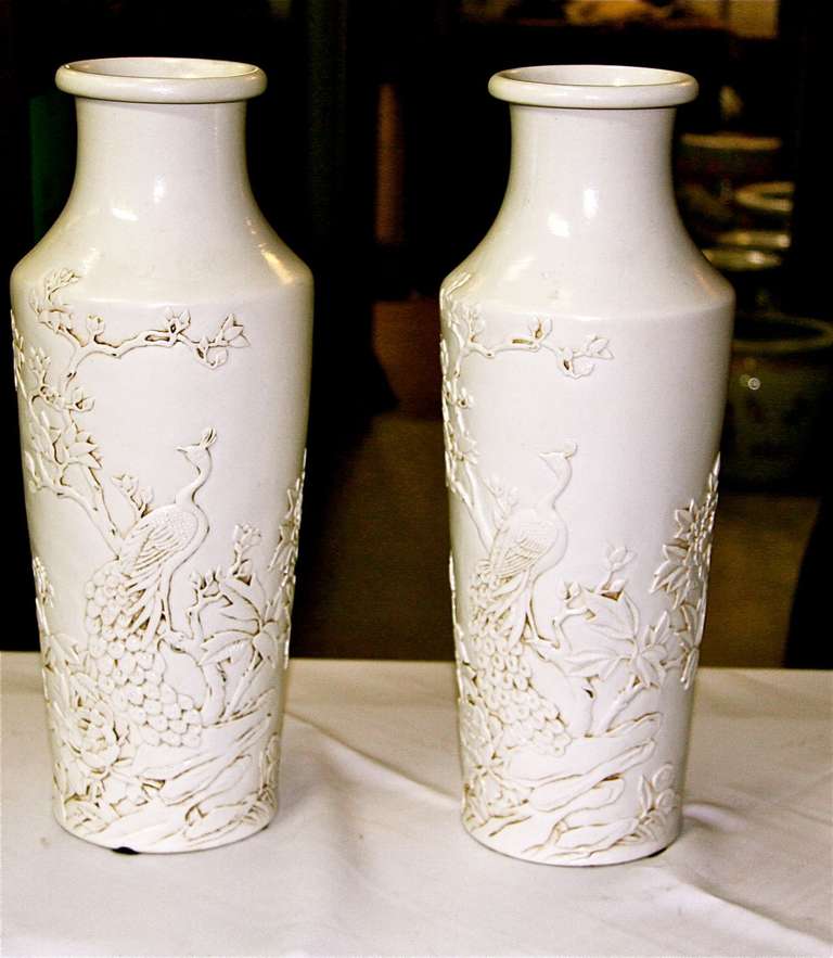 Pair 16 inch Blanc de Chine low relief Chinese vases. Can be mounted into 30 inch lamps.