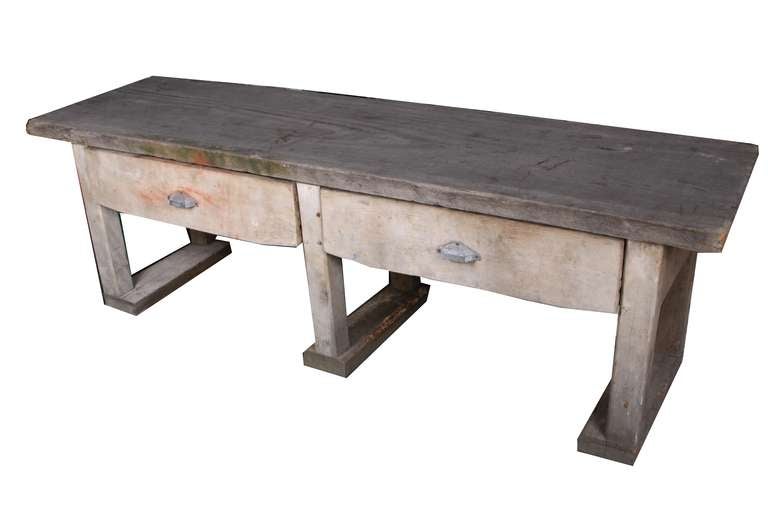 Primitive style garden table from France, 1890. Large and very sturdy, with two operable drawers. Metal drawer pulls. Take note of the dovetail joinery.