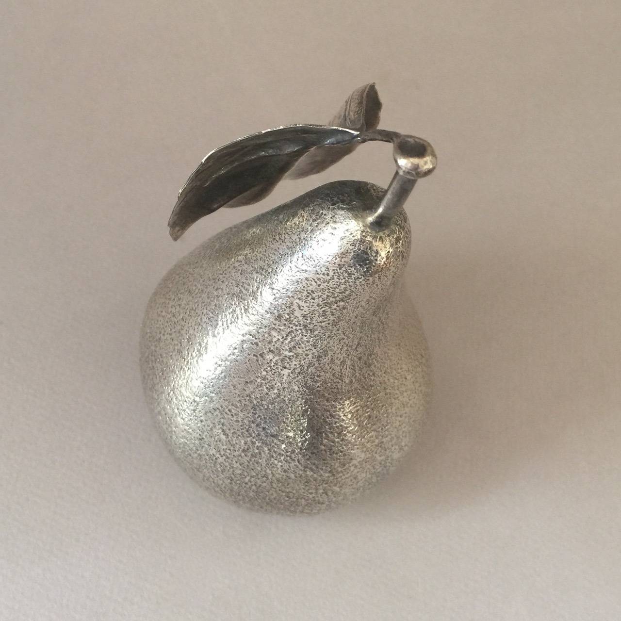 Buccellati Sterling Silver Pear

Exquisite representation of a pear, handmade in sterling silver. Heavy gauge silver. Realistically designed, life sized pear. 

Designer:	Buccellati
Maker:	Buccellati
Design #:	N/A
Circa:	20th