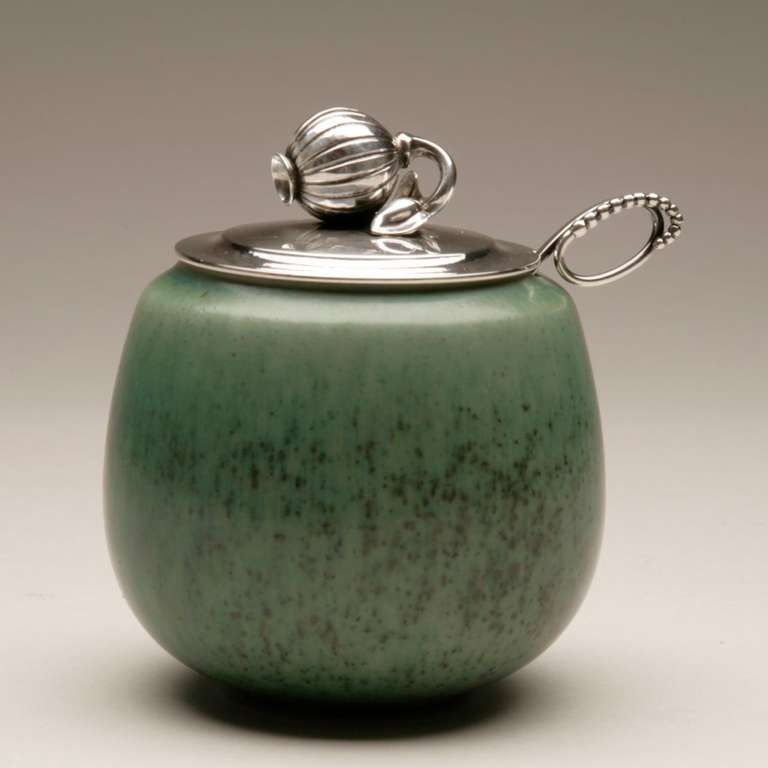 Rare sterling silver jam pot lid with seed pod design atop a speckled-green heavy Danish Saxbo spherical pot. Lid designed my Harald Nielsen. Accompanied Georg Jensen ornamental spoon, no. 41.