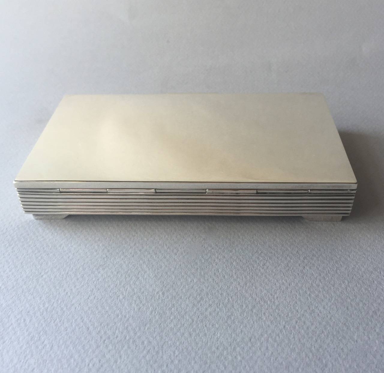 Georg Jensen box, no. 712 by Sigvard Bernadotte. Sleek, machine-age period.  Heavy gauge sterling silver, impressive weight and hand made.  Perfect gift. Hand-engraving available. ( Inside of lid is suggested) 

Sigvard Bernadotte (1907 - 2002)