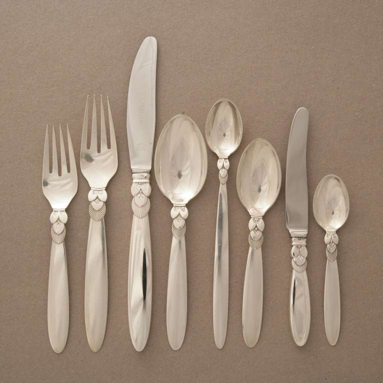 Georg Jensen Cactus pattern Sterling Silver flatware set, service for 8. 72 pieces total. 

Set includes 8 each of the following:

Dinner Knife
Fruit Knife
Dinner Fork
Salad Fork
Tea Spoon
Small Tea Spoon
Soup Spoon (rounded bowl)
Ice Tea