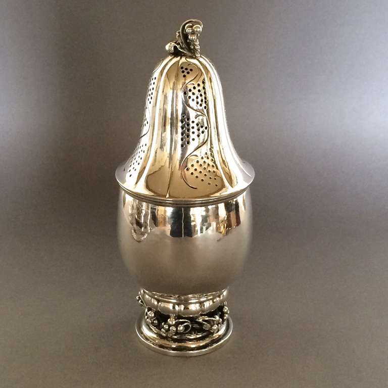 Georg Jensen large grape sugar caster no. 296.

Rare to see in the large size, this sugar caster will stand out in your collection.

Designed by Georg Jensen in 1919 by Georg Jensen himself, this example bear hallmarks from 1933-44 and is in