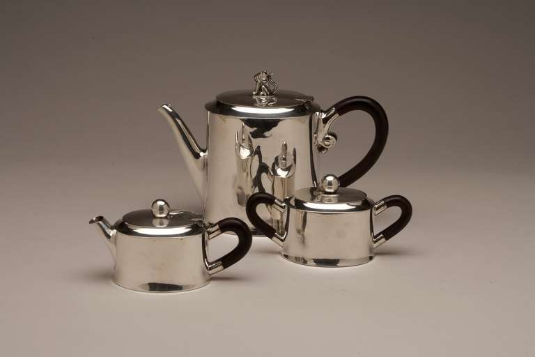 William Spratling three piece (Jaguar) coffee service.

Hand-wrought sterling silver coffee service by William Spratling, with Jaguar finial on lid of coffee pot. Made in Taxco, circa 1960s. 

Coffee pot: 6