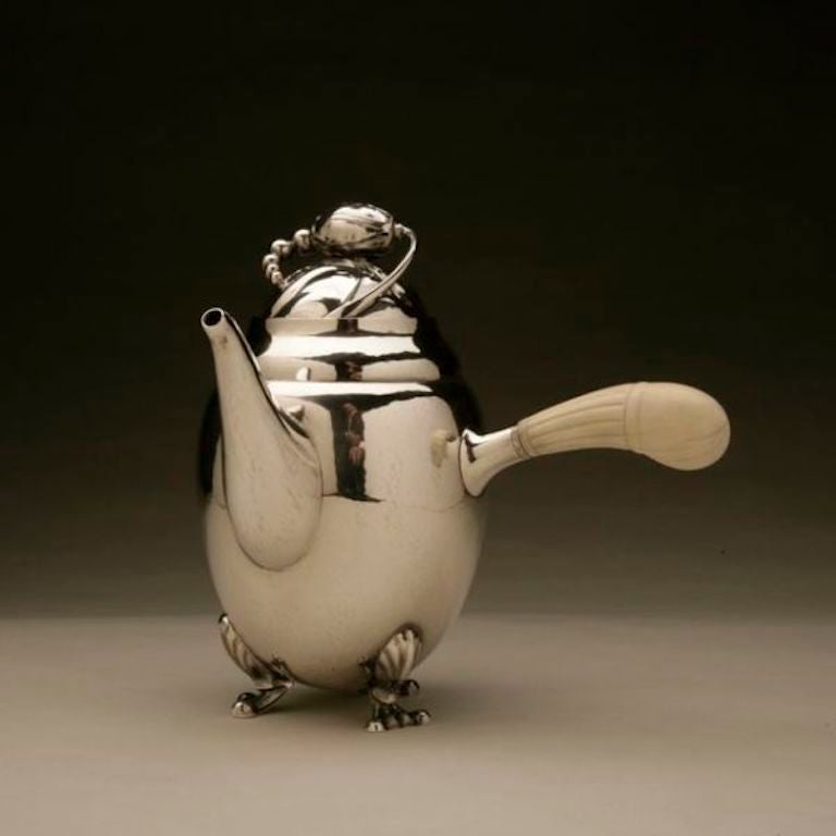 Georg Jensen sterling silver blossom coffee pot no. 2B.

Visible hand hammering, bone handle. Iconic blossom design. The 