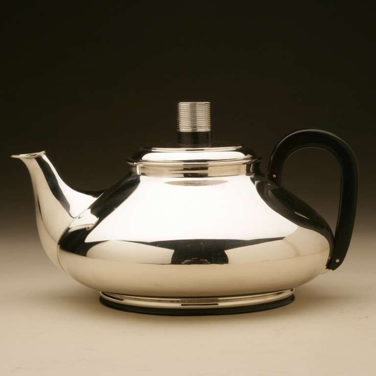 Frantz Hingelberg Modernist Teapot designed by Svend Weihrauch

Extraordinary design with exquisite detail. Ebony ringed foot, handle, and finial detail. Entirely hand wrought and beautifully balanced.

Svend Weihrauch was born in Viborg,