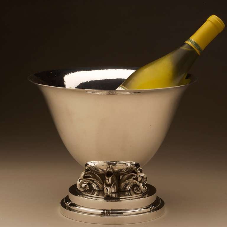 Exquisitely hand wrought tall round bowl mounted on stylized scrolls and stepped base. Extremely heavy sterling silver. Can be used as a champagne cooler. Handmade in Denmark at the Evald Nielsen smithy.