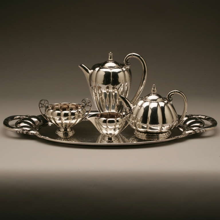 Georg Jensen Exceptionally Rare Coffee and Tea Service no. 179 on Tray no. 159

Very heavy with visible hand-hammering throughout in mint condition. 

Tray 24