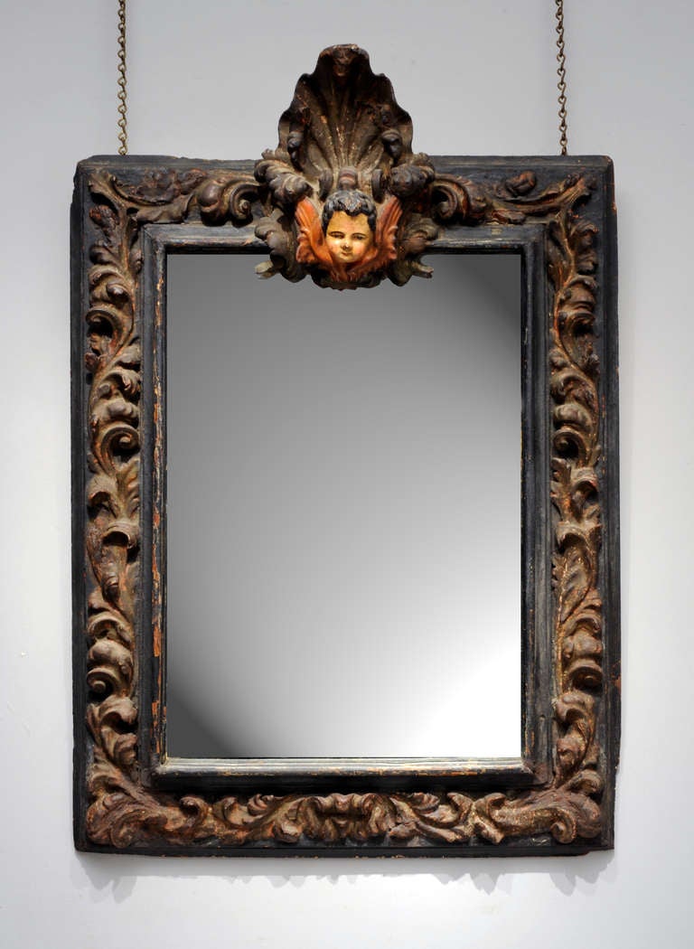 In Italy during the 17th century, ornately carved frames such as this adorned the homes of the nobility.  The baroque period is characterized by exaggerated motion and clear, easily interpreted detail to produce drama, tension, exuberance, and