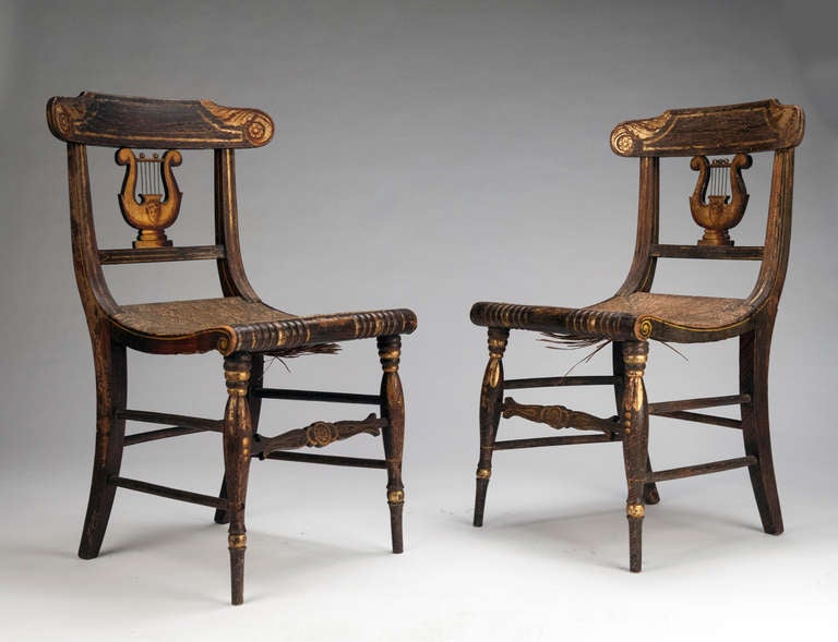 Lyre back chairs emerged from the Classical Greek period, reflecting, stylistically, the curving shape of a lyre. 

In a furniture context, the design is often associated with the American Federal Period.  Well known designers who employed this