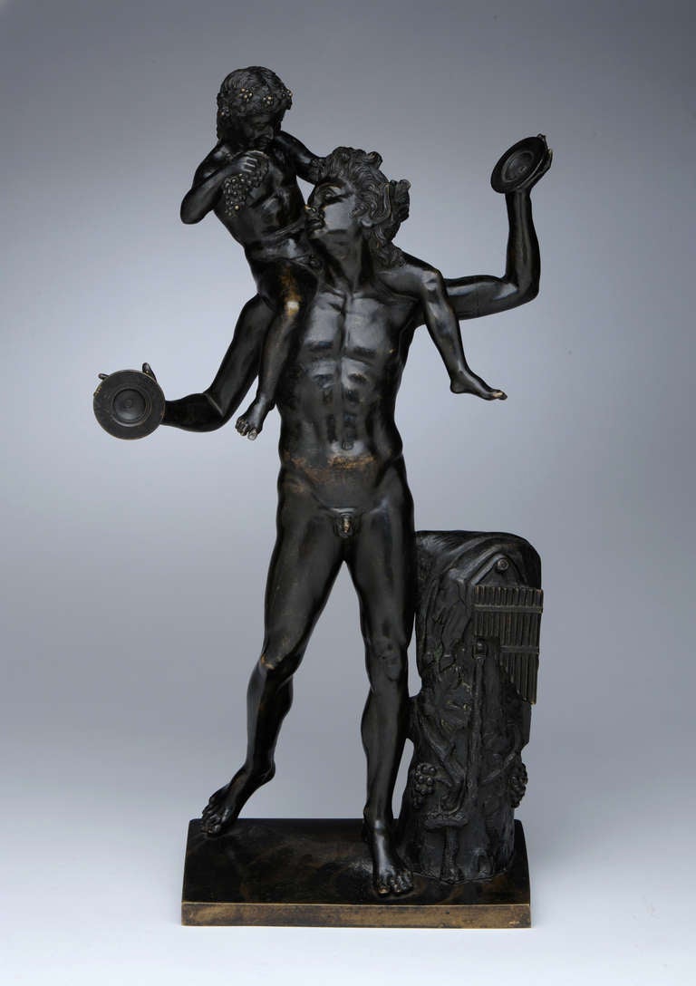 Pan and the Infant Bacchus, 19th century (after the Antique)
cast by P. Masulli Foundry, Naples
Bronze, dark brown patina with lighter high points
23 x 13 x 6 inches (overall)

The sculpture depicts the faun with cymbals, leaning against a