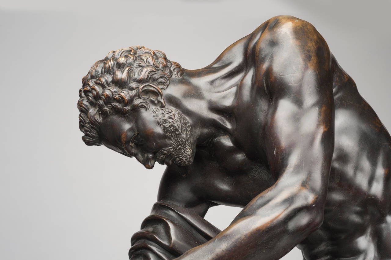 Lost-wax bronze cast of the Milo of Croton.  Chocolate brown varnish.
French, after Edmé Dumont from a model first exhibited in 1769

Milo of Croton, the renowned athlete of Greek myth, is depicted rending apart the stump of an oak tree with
