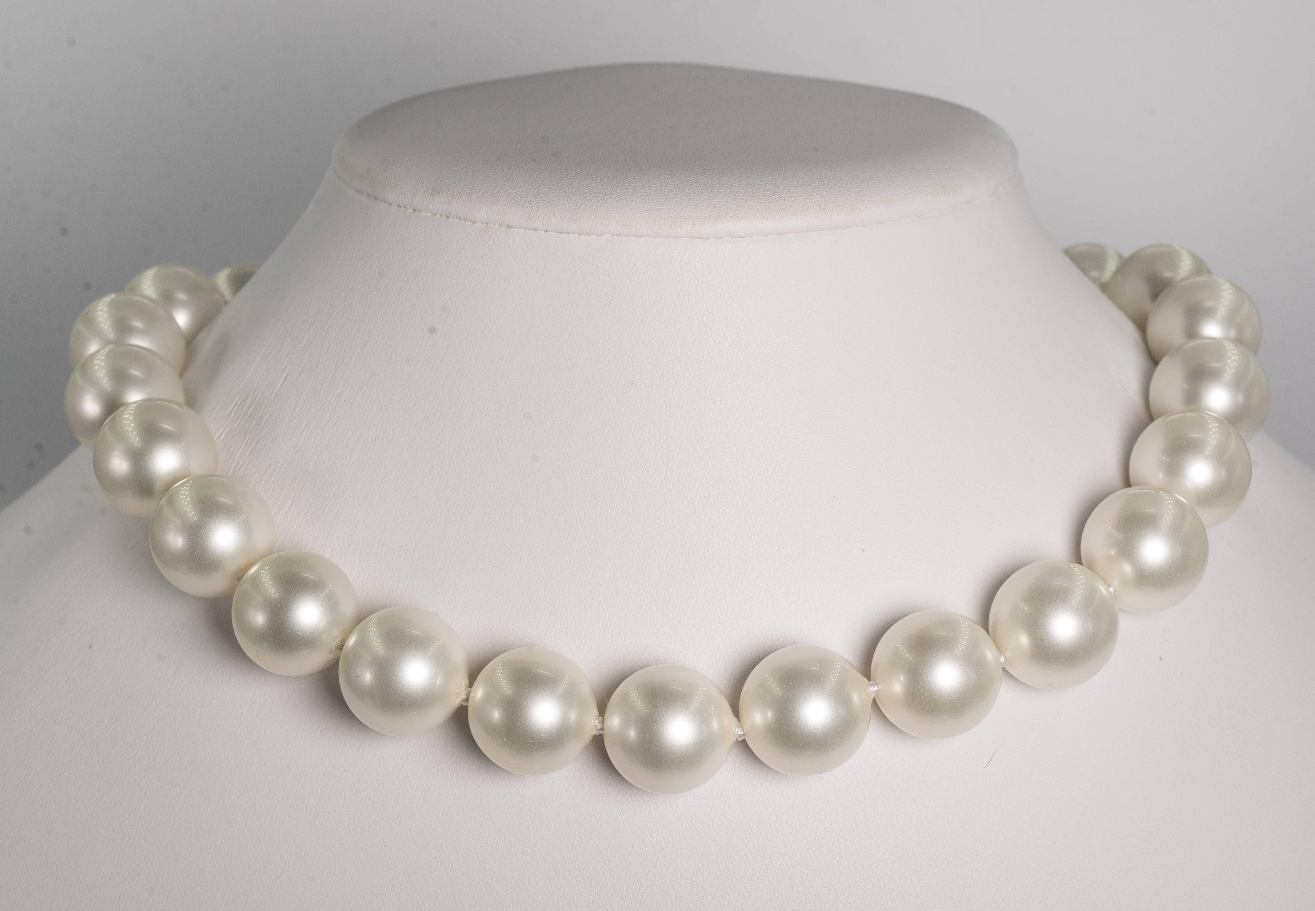 Wonderful delicate white shade of handmade lustrous Japanese faux pearls beautifully strung 14mm 18'' long with pave Cubic Zirconia screw ball clasp.