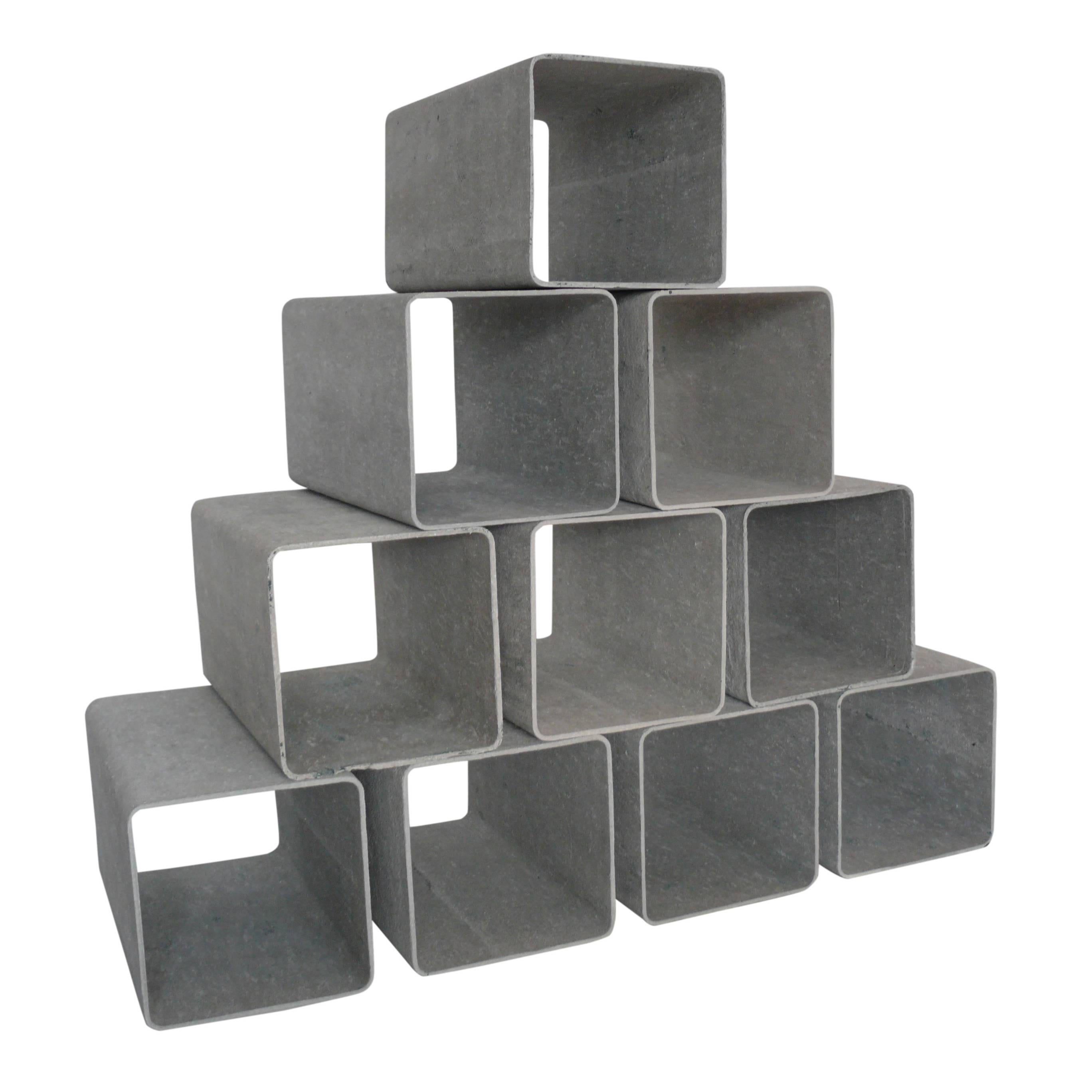 Incredibly rare cement and fiber modular shelving cubes by Willy Guhl. Each cement cube is free standing and light weight enough to rearrange with ease. Would make an incredible room divider, media storage, or display shelves! Great patina.